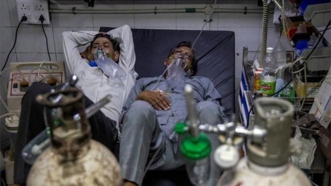 Patients suffering from the coronavirus disease (COVID-19) get treatment at the casualty ward in Lok Nayak Jai Prakash (LNJP) hospital, amidst the spread of the disease in New Delhi,