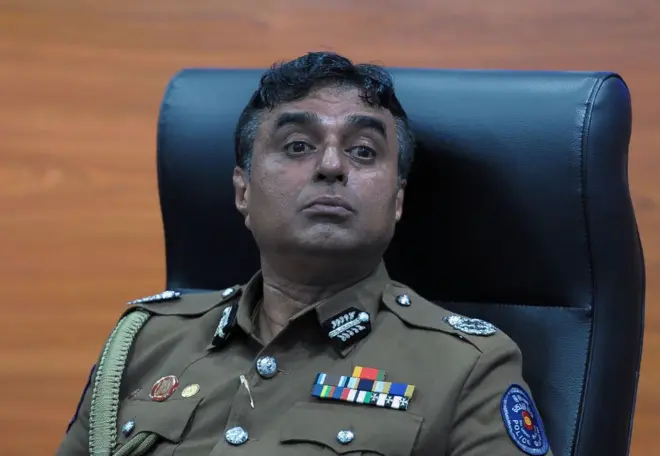 Sri Lanka police chief Pujith Jayasundara looks on after launching the first on-line service delivery of the Sri Lankan police at the headquarters in Colombo on March 7, 2017.
