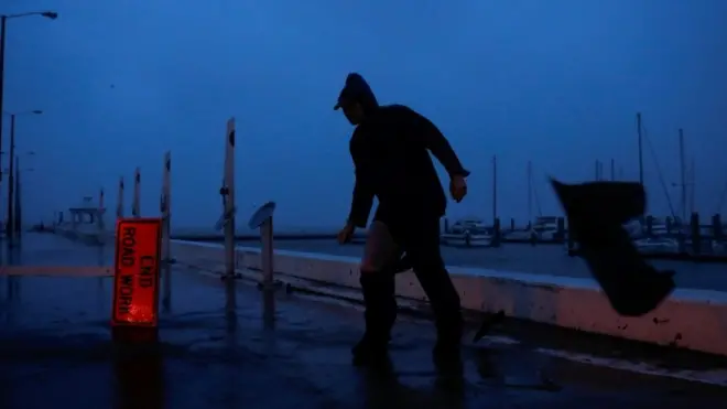 Man in Corpus Christi, TX as Hurricane Harvey blows in, 25 August 2017