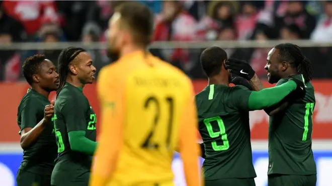 Nigeria's Victor Moses (R) is congratulated by his teammates after scoring the 0-1 during the international friendly football match of Poland vs Nigeria in Wroclaw, Poland, on March 23, 2018