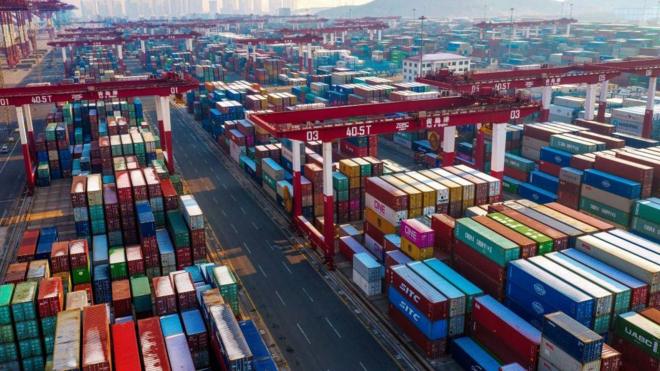 Containers are seen stacked at a port in Qingdao in China's eastern Shandong province.