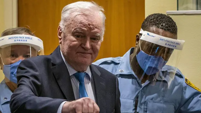Ex-Bosnian Serb military chief Ratko Mladic arrives in the courtroom prior to the hearing of the final verdict on appeal against his genocide conviction over the 1995 Srebrenica massacre