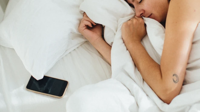 woman asleep with phone