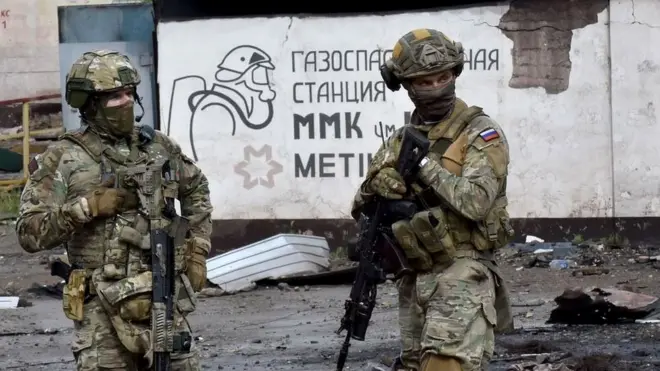 Russian troops in the devastated port city of Mariupol