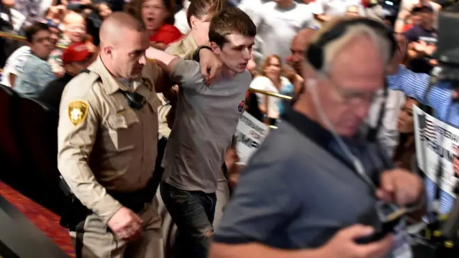 Police make arrest at Donald Trump's campaign rally at the Treasure Island Hotel Casino in Las Vegas, Nevada, 18 June