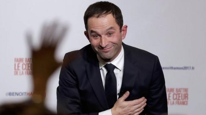 Former French education minister Benoit Hamon reacts after partial results in the second round of the French left"s presidential primary election in Paris, France, January 29, 2017