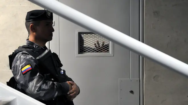 A security guard stands outside a cell, during a press tour inside the new maximum security pavilion at La Picota prison in Bogota, Colombia, on March 30, 2011.