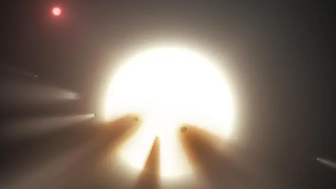 Esta ilustración muestra una estrella detrás de un cometa hecho pedazos. ¿Podría estar nuestra misteriosa estrella comiéndose un planeta?