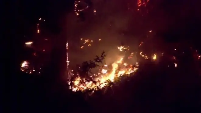 Footage show fire wey dey burn for di spot where di plane go down