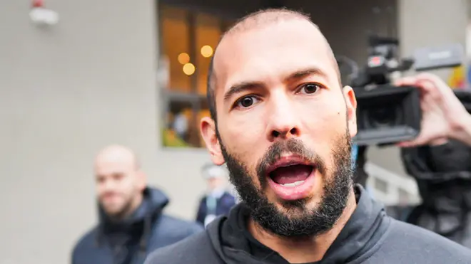 British-US former professional kickboxer Andrew Tate talks to media as he leaves Romania&#x27;s anti-organized crime and terrorism directorate (DIICOT), after a digital investigation of devices, where his presence was required, in Bucharest, Romania on January 25, 2023.