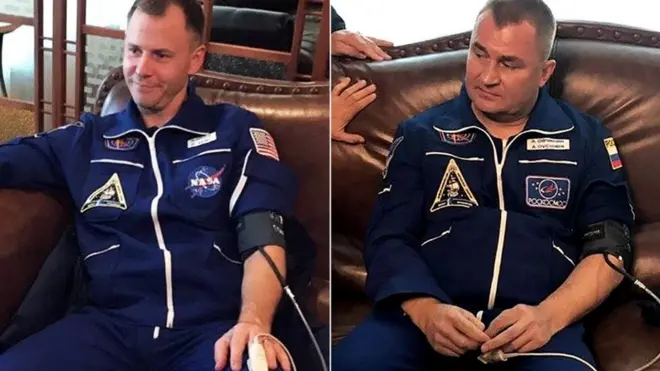 US astronaut Nick Hague and cosmonaut Alexey Ovchinin after landing safely following an incident with their Soyuz rocket, 11 October 2018