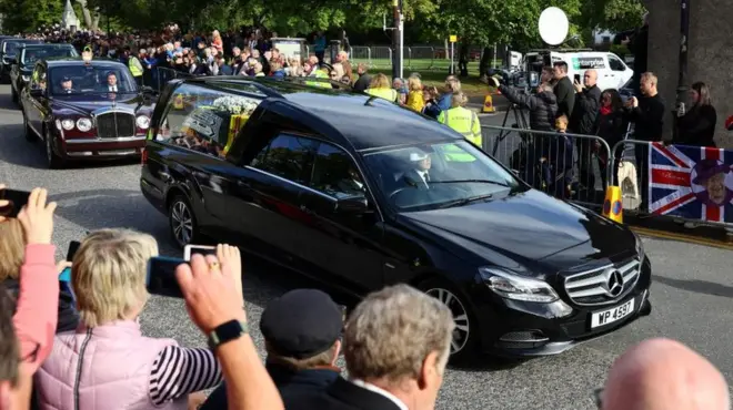 The Queen's funeral cortege is observed