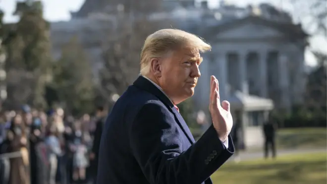 President Donald Trump waves as he walks to Marine One on the South Lawn of the White House on 12 January