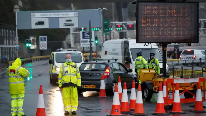Security officers stand guard at an entrance of the Port of Dover