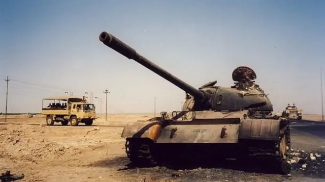 Burnt-out tank in Basra, Iraq, in 2003