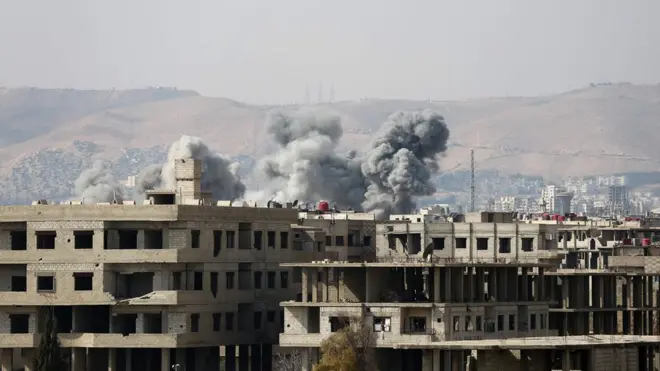 Smoke billows following a regime air strike on the rebel-held town of Haza, in the besieged Eastern Ghouta region on the outskirts of the capital Damascus, 23 February 2018