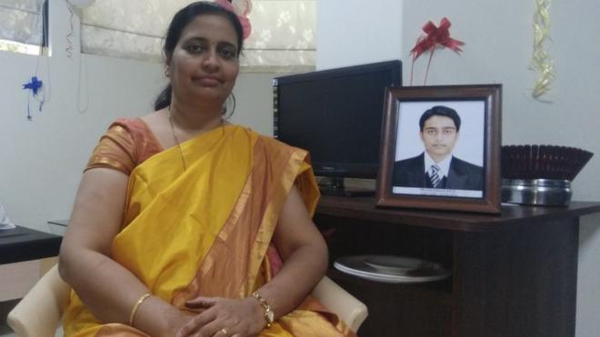 Rajashree Patil sits next to a photo of her son, Prathamesh.