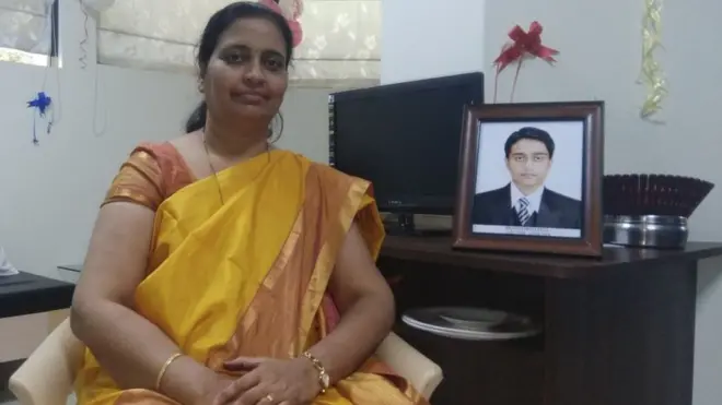 Rajashree Patil sits next to a photo of her son, Prathamesh who died of brain cancer.