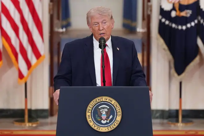 U.S. President Donald Trump tok from di Cross Hall of di White House on April 1, 2026 in Washington, DC. Trump use di prime-time address to update di nation on di war for Iran.