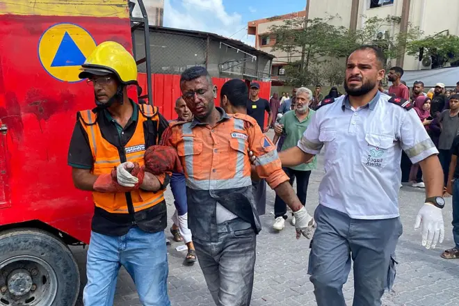 Palestinian medics bring an injured man at Nasser Hospital in Khan Yunis, in the southern Gaza Strip, on August 25, 2025,