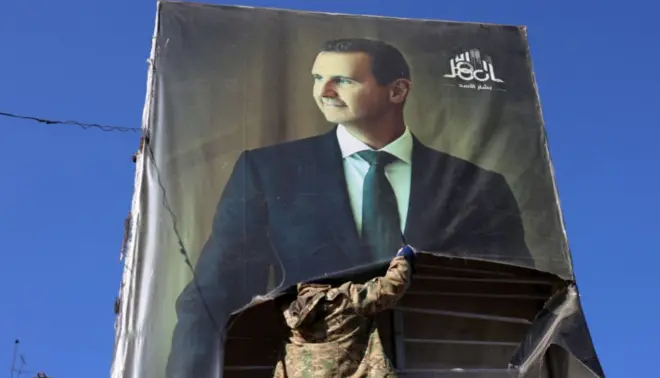 Imagema2sport betBashar-al Assad na laterala2sport betum prédioa2sport betDamasco, na Síria