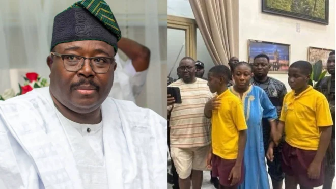 Sharafadeen Alli wọ aṣọ funfun, o wa ni apa osi, Aburo Adebayo Adelabu atawọn ọmọ rẹ to fi mọ ero mii wa ni apa ọtun