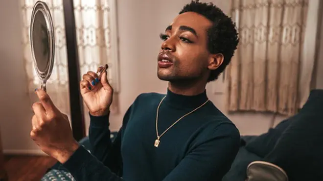 Crossdresser hold mirror