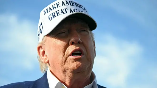 US President Donald Trump speaks to journalists before boarding Air Force One from Morristown Municipal Airport in Morristown, New Jersey, May 25, 2025