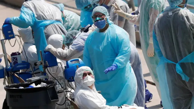 First responders evacuate sick crew members with flu-like symptoms from two cruise ships in Miami