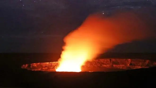 Stars shine above as a plume rises from the Halemaumau crater, at the Hawaii Volcanoes National Park on 9 May 2018 in Hawaii Volcanoes National Park, Hawaii