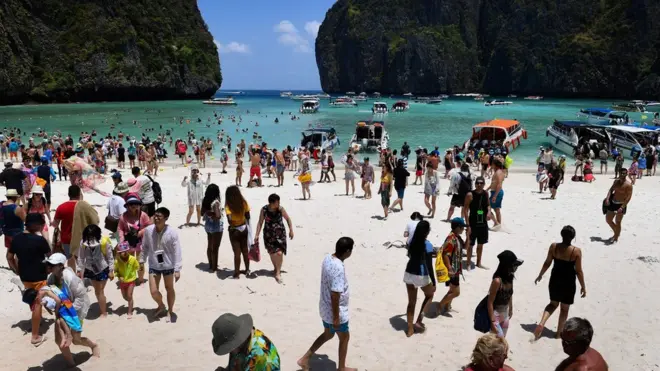 Maya Bay crowded with tourists in April 2018. Its shores are now empty.