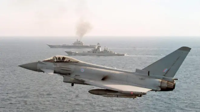 An RAF Typhoon escorts the Russian carrier Admiral Kuznetsov