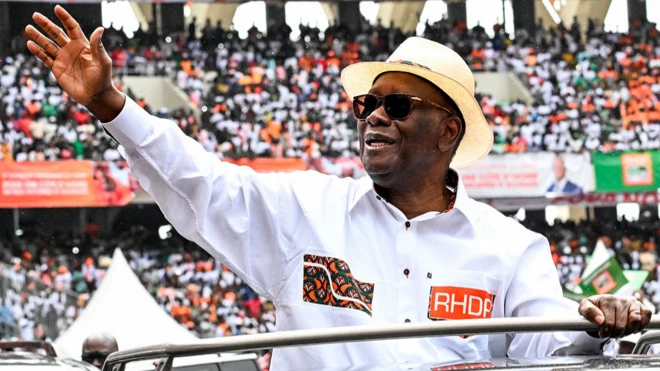 President Ouattara waving at a crowd