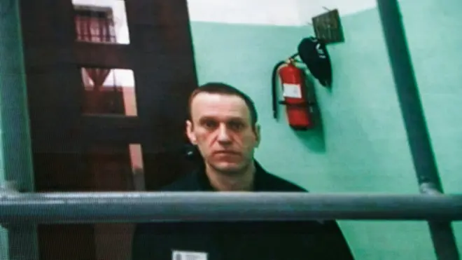 Jailed Russian opposition figure Alexei Navalny appears on a screen via a video link from his penal colony during court hearings in Moscow, 22 June 2023