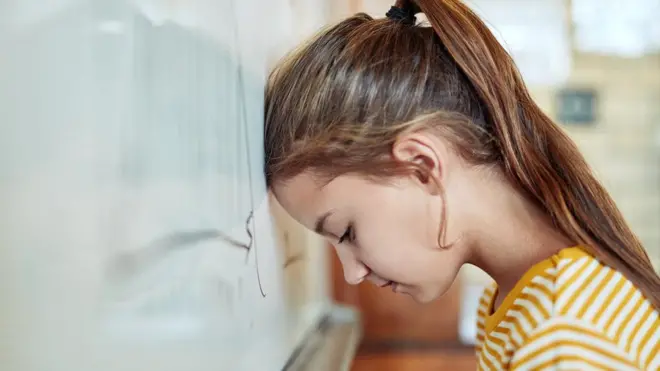 A young girl in a classroom