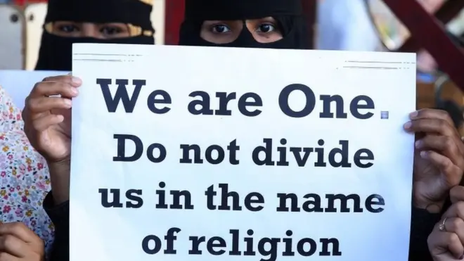 People from different human rights organizations hold placards during a protest against BJP-lead government and Chief Minister of Uttar Pradesh Yogi Adithyanath over the so-called "love Jihad" law,