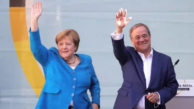 Christian Democratic Union (CDU) party chairman and top candidate for the upcoming federal elections Armin Laschet (R) and German Chancellor Angela Merkel (L) during the election campaign closing of the CDU in Aachen, Germany, 25 September 2021.