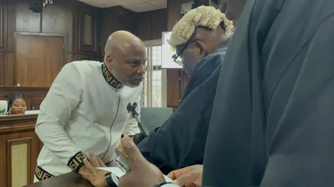 Nnamdi Kanu having a chat with his lawyer in court May 28, 2025