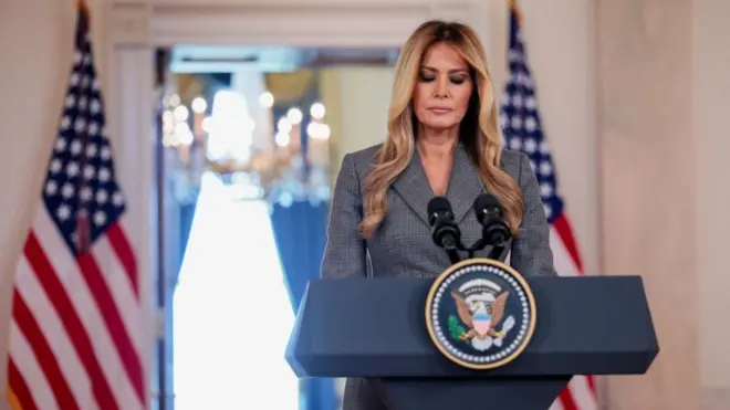 Melania at a podium 
