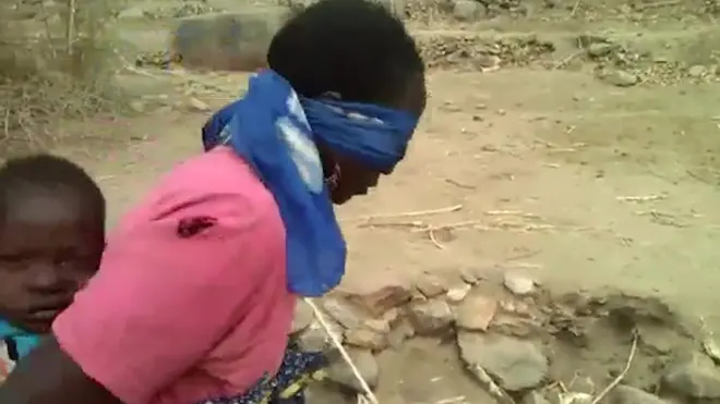 Blindfolded woman and child