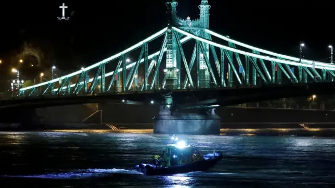 A rescue team scours the Danube for survivors after a tourist boat capsized