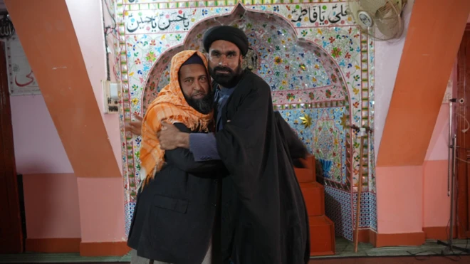 A Shia and a Sunni man embracing
