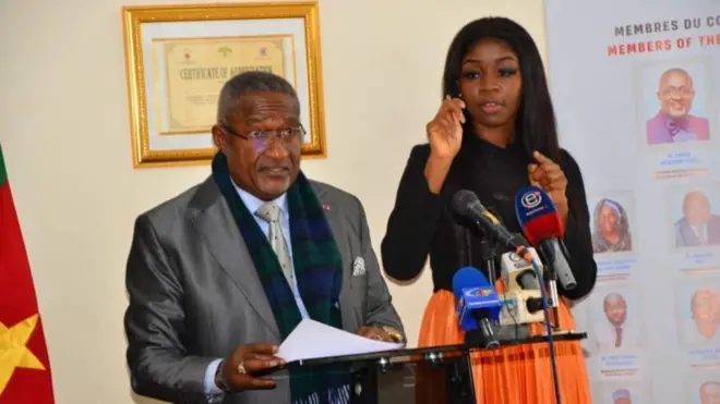 Elecam chairman Dr. Enow Egbe wear one grey suit, during di constitution of di National Commission for di final vote counts