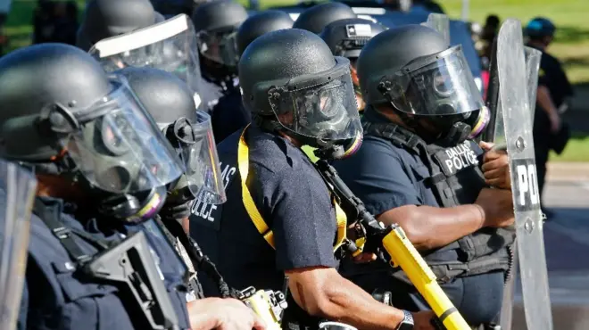 Police officers face off with demonstrators during protests over the Minneapolis arrest of George Floyd, who later died in police custody, in Dallas, Texas, USA, 30 May 2020. (EPA)