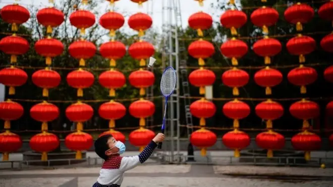 Boy plays badminton in Wuhan street - 8 February