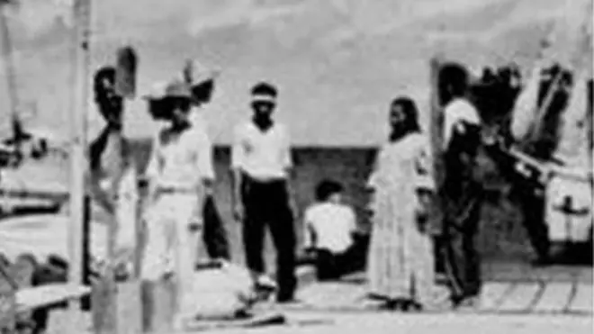 Pier on Jaluit Atoll with a group of people