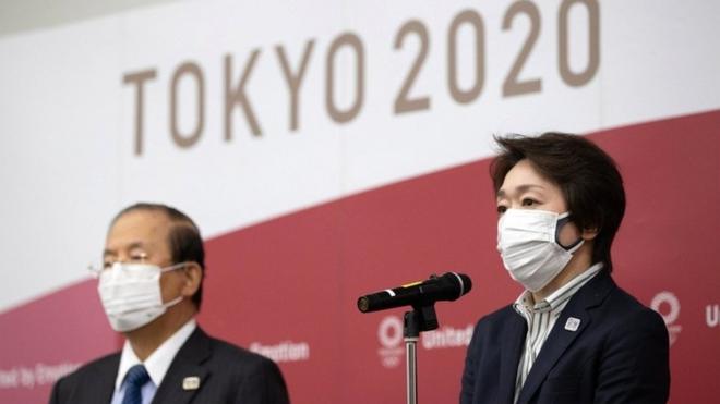 Tokyo 2020 Organising Committee CEO Toshiro Muto (L) and Tokyo 2020 Organising Committee President Seiko Hashimoto speak to media after video conference with IOC executive board, on 24 February 2021