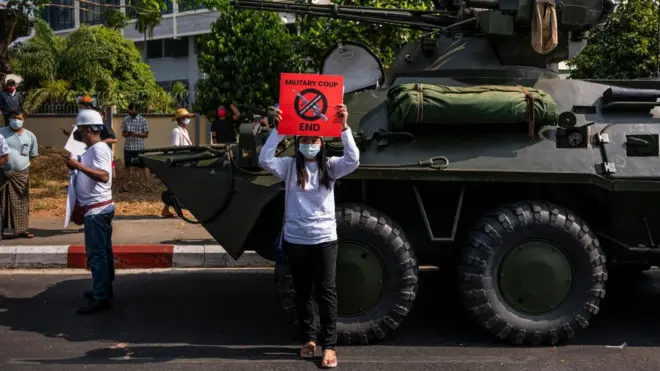 Protesters lined the streets where armoured vehicles were deployed near the Central Bank in Yangon