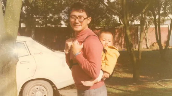 Mr Chang, seen here with one of his children in Taiwan before his defection, enjoyed a comfortable life at that time