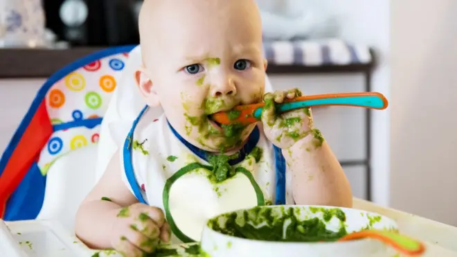 Toddler eating solids